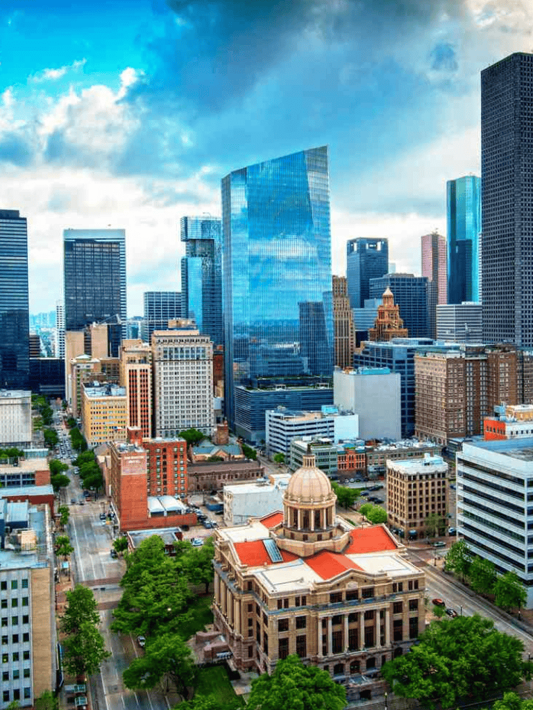 City skyline with modern skyscrapers and historic buildings in downtown.