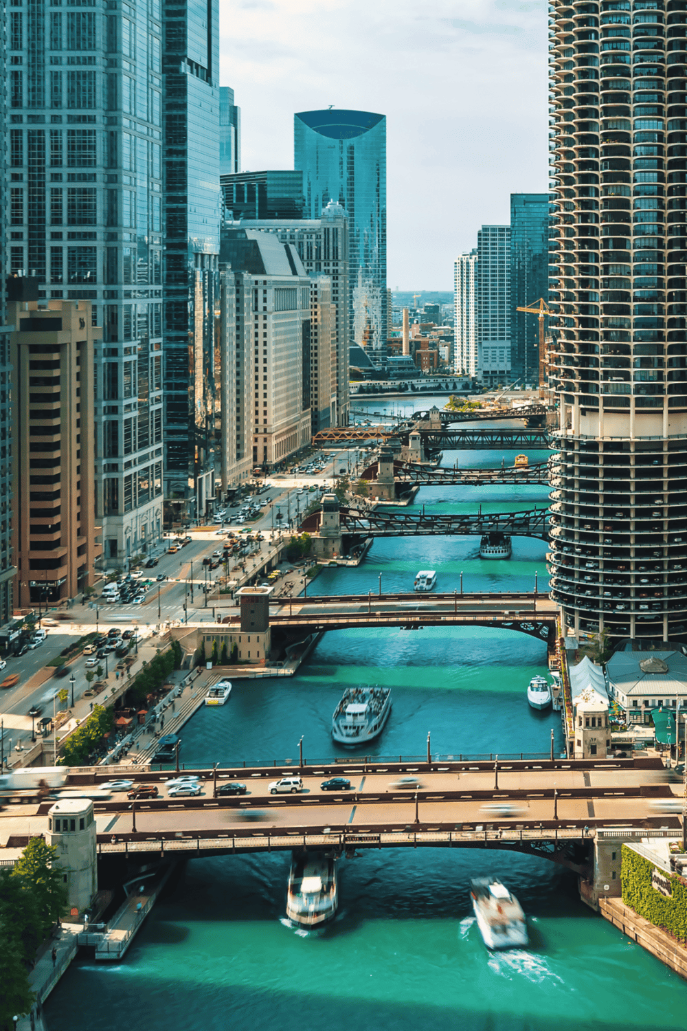 Elevated view of Chicago downtown skyline with river and boats, adventure and navigation in urban landscape.