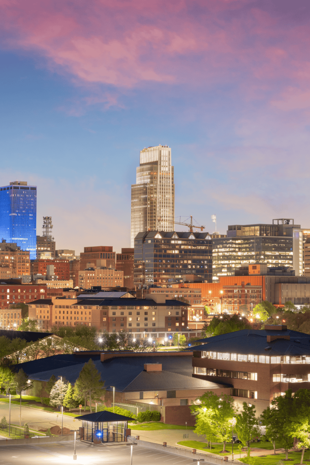 Vibrant cityscape of downtown with skyscrapers and modern buildings at dusk, highlighting urban navigation and directions.