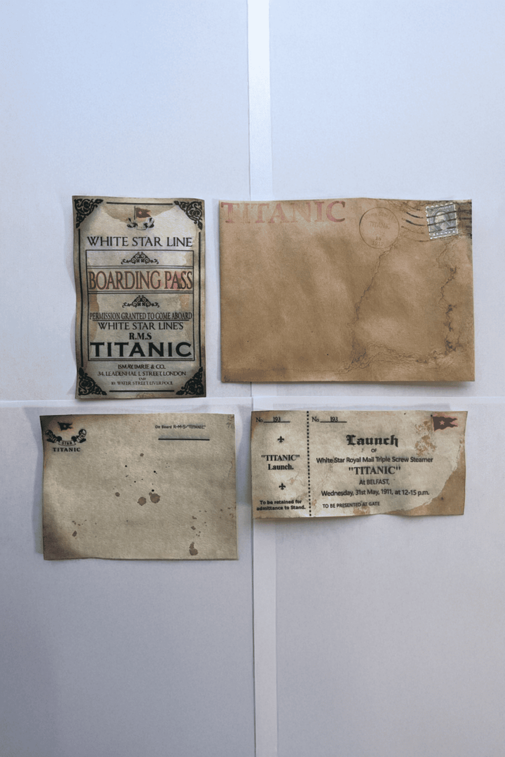 Vintage Titanic boarding pass and launch tickets promoting Titanic voyages and travel bookings.