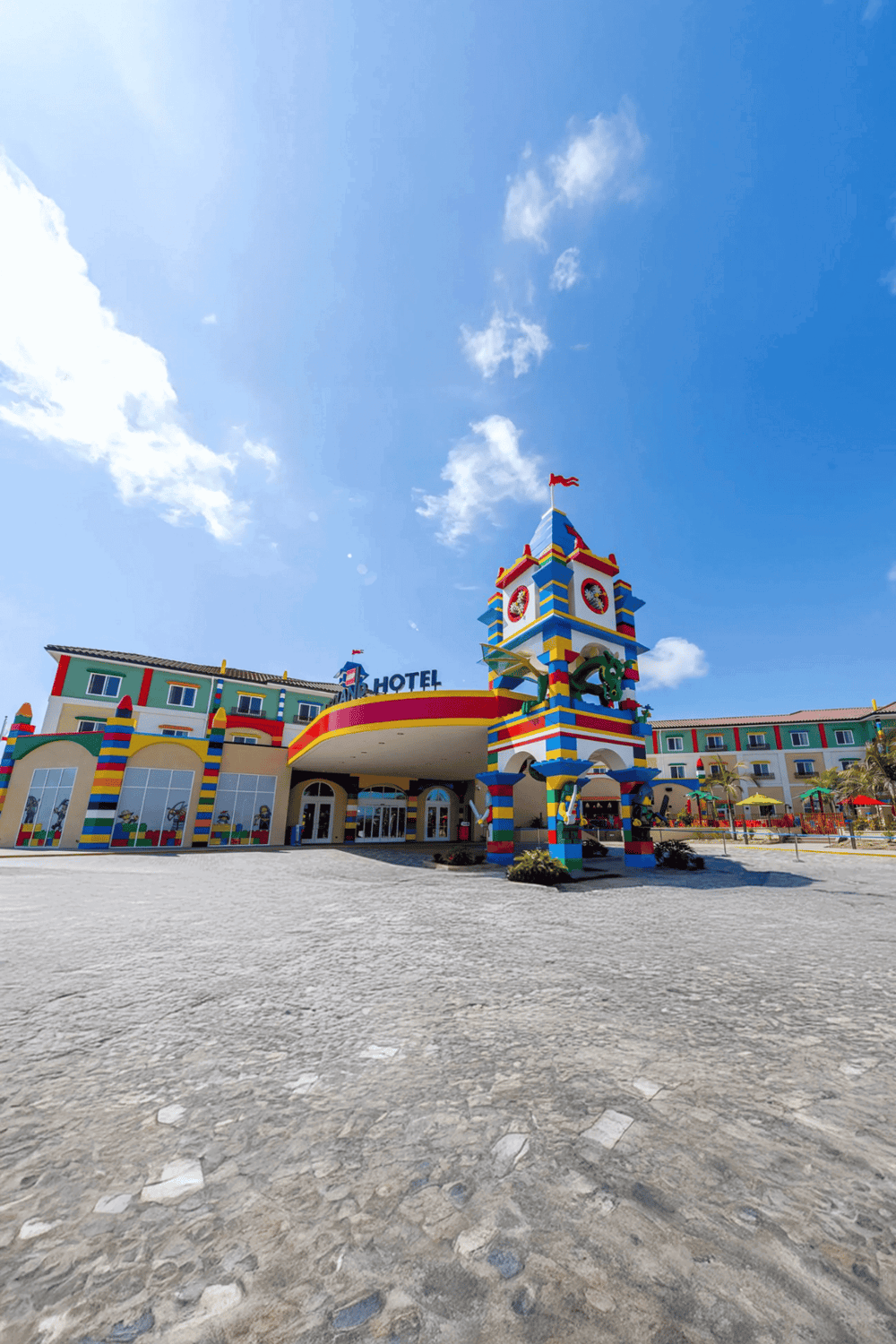 Colorful Lego-themed hotel with a playful tower and vibrant design, perfect for family vacations and fun getaways.