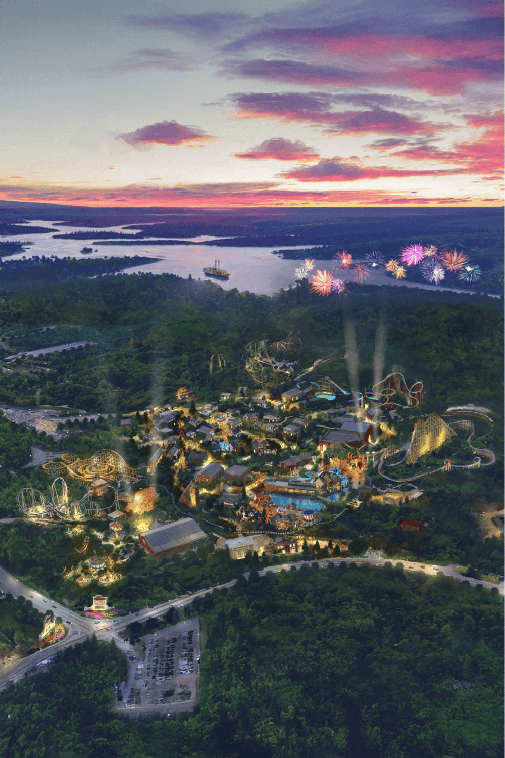 Vibrant amusement park with fireworks over water, lush greenery, roller coasters, and scenic sunset views.