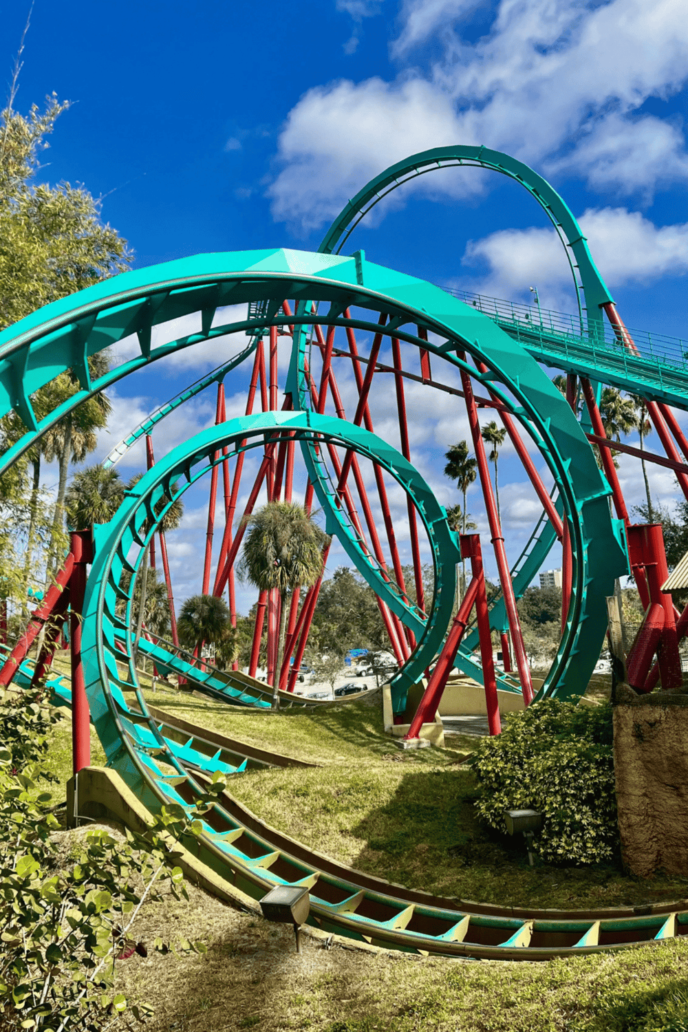 Thrilling green roller coaster at Quest For Directions amusement park.