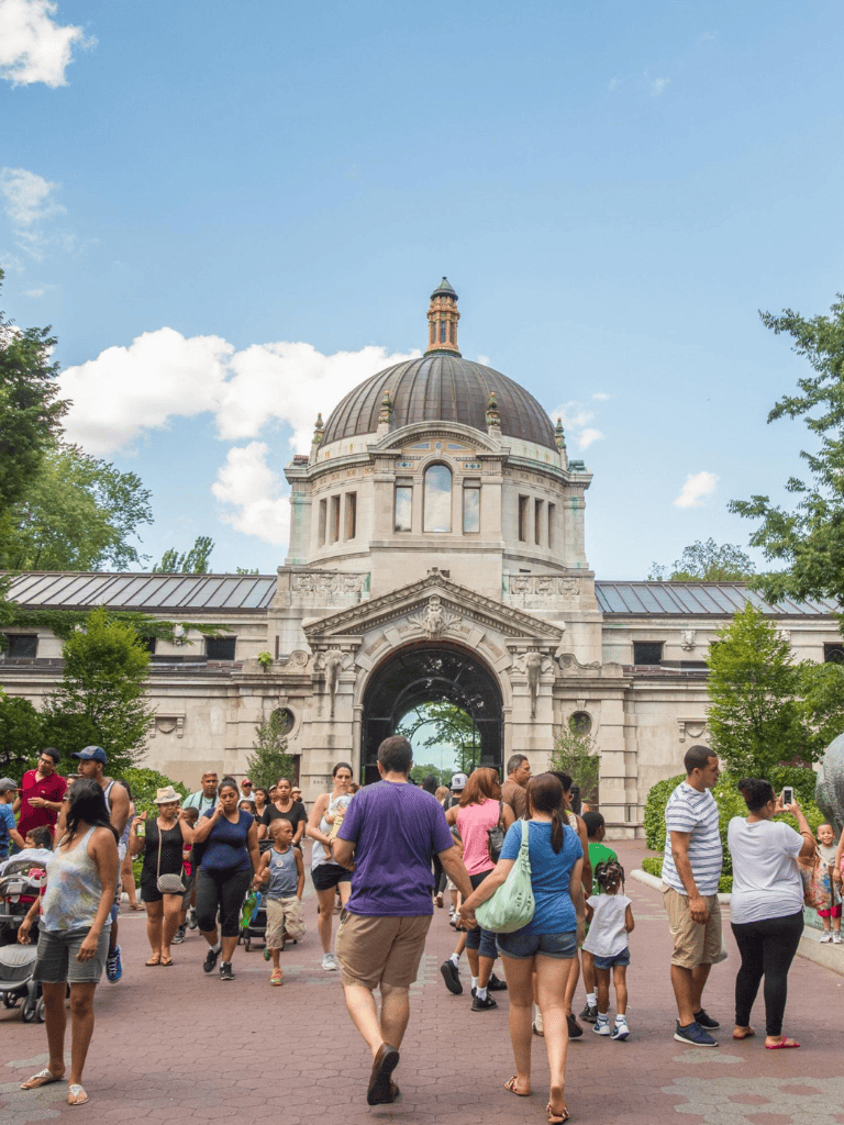 Old Capitol Dome at Quest for Directions during busy event in daytime.