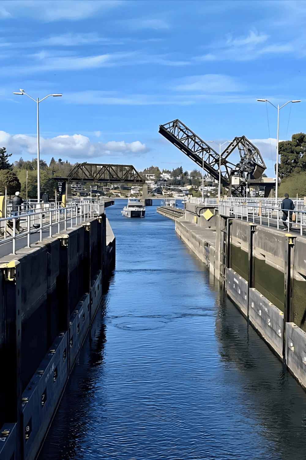 Jet boat navigating through the Canal, crossing lift bridge in a scenic waterway.