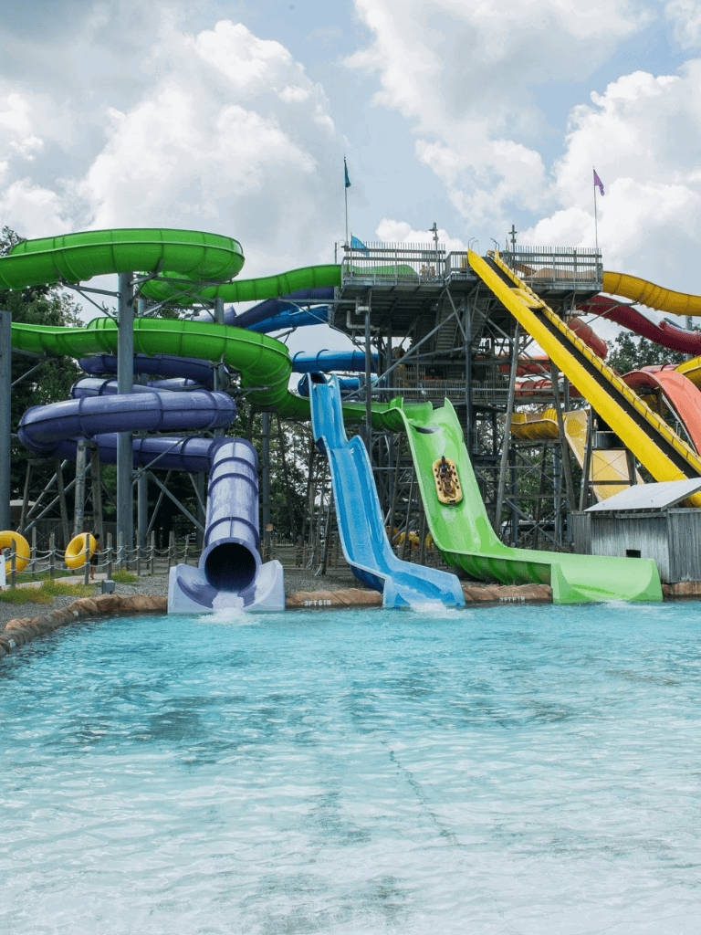 Brightly colored water slides at Quest for Directions aquatic park, perfect for family fun and adventure.