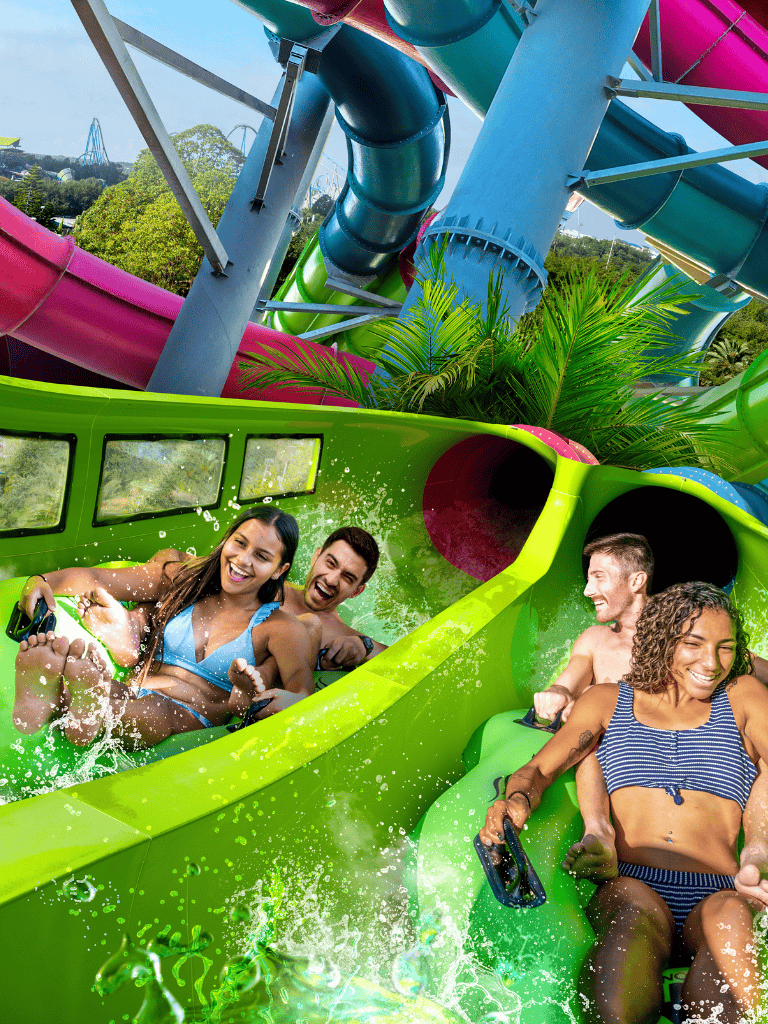 Thrilling water slide at QuestForDirections amusement park with excited visitors.
