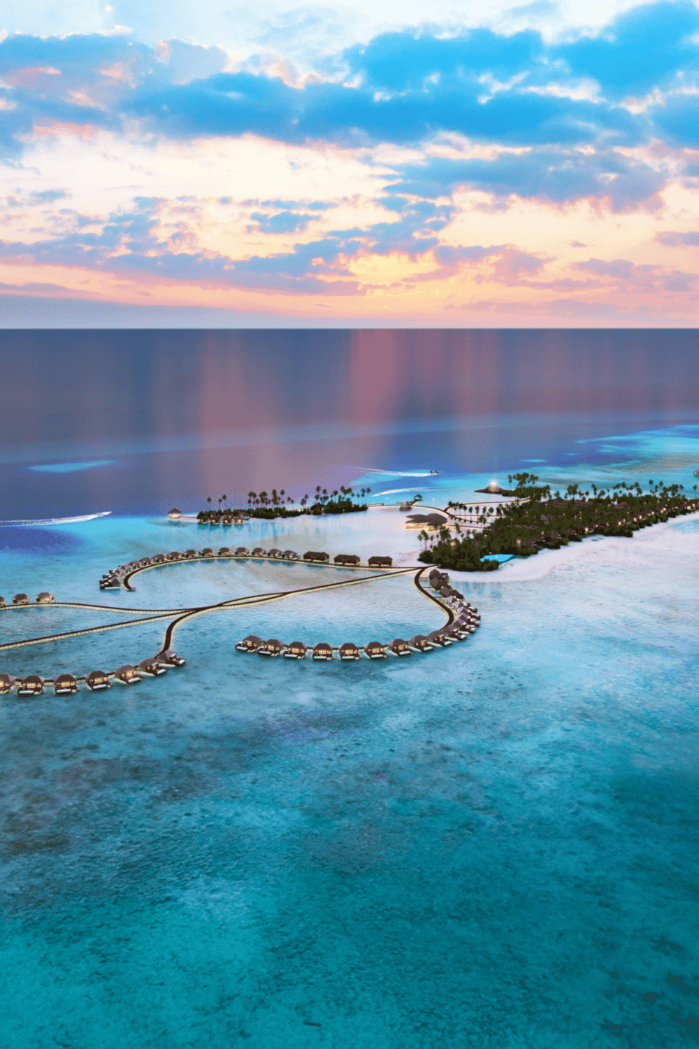 Overwater bungalows at a tropical island resort during sunset for luxury travel and vacation planning.