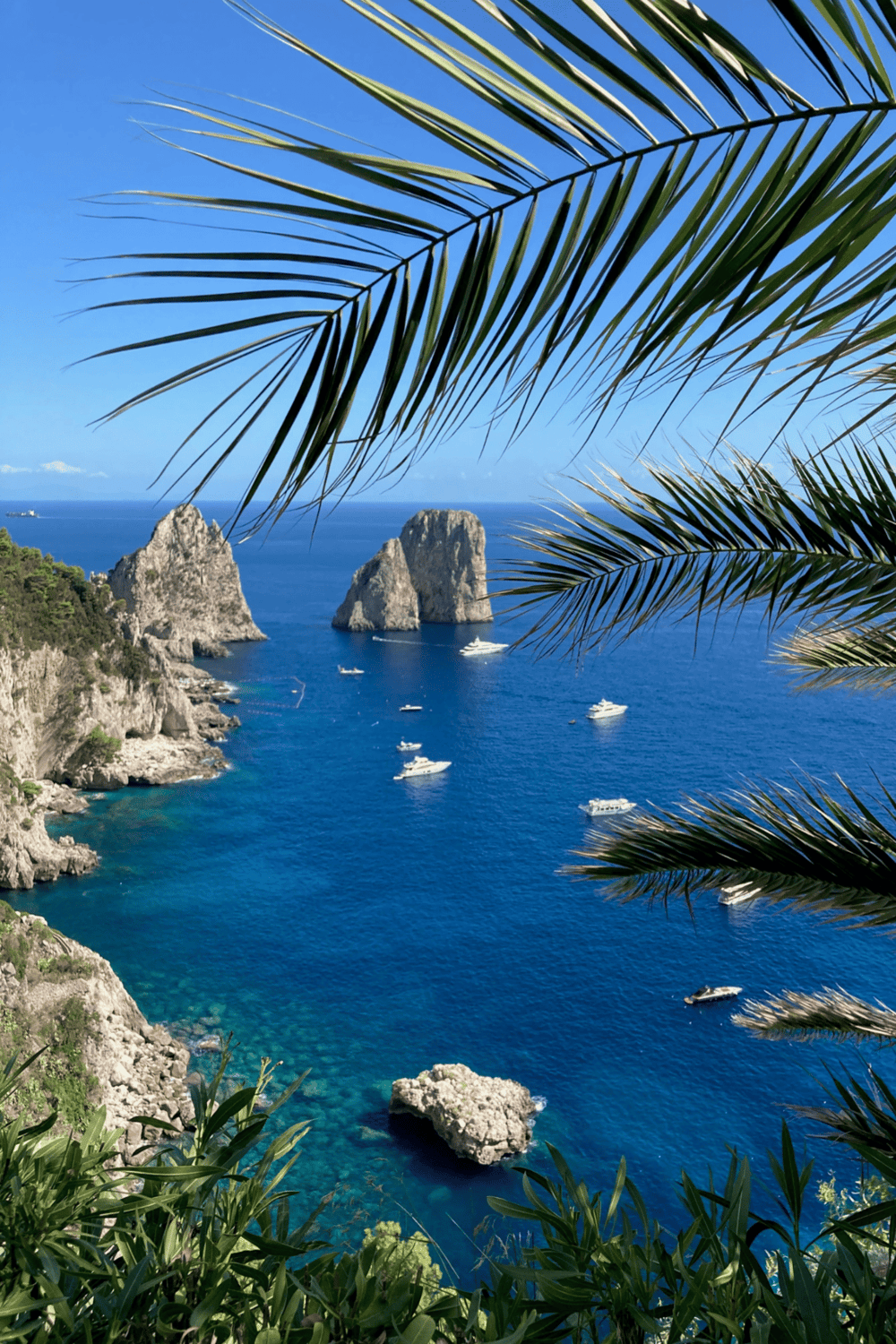 Vibrant coastal landscape with blue waters, rocky cliffs, and lush greenery, perfect for travel and adventure.