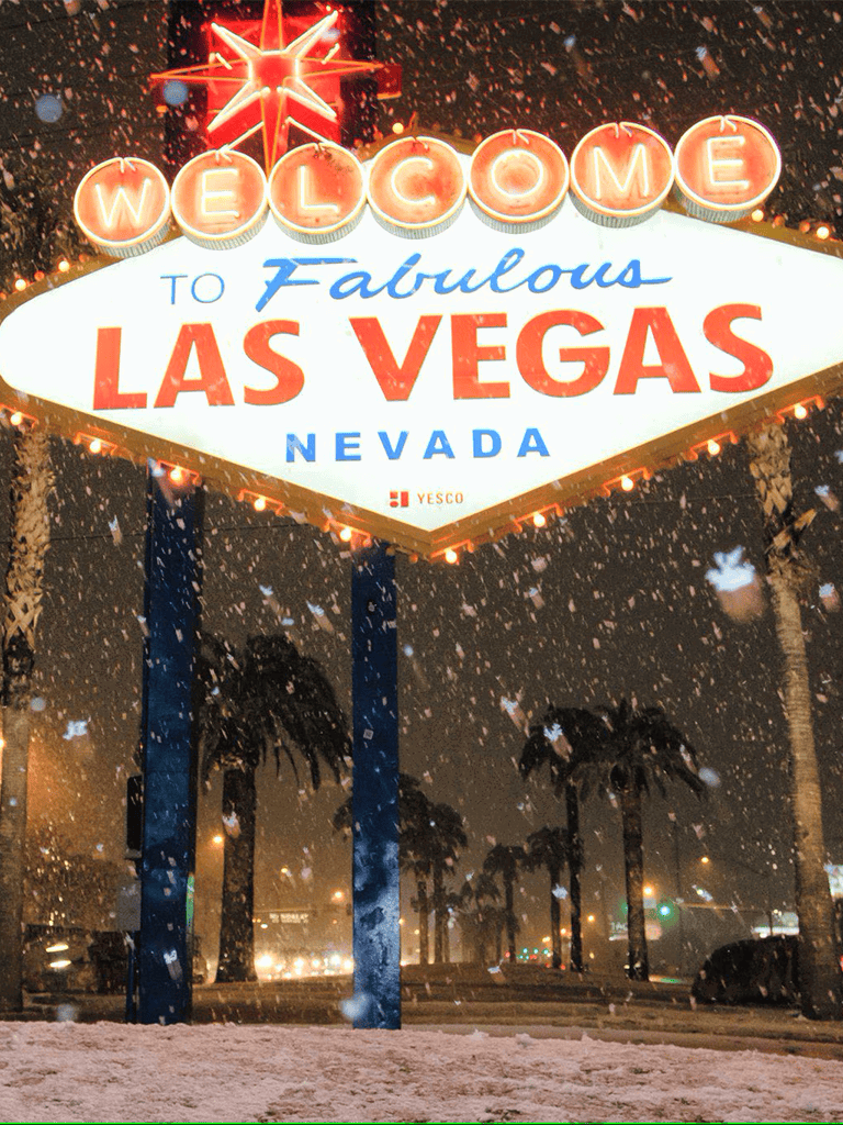 Welcome to Las Vegas sign at night with snow, iconic city landmark in Nevada, travel destination photography.