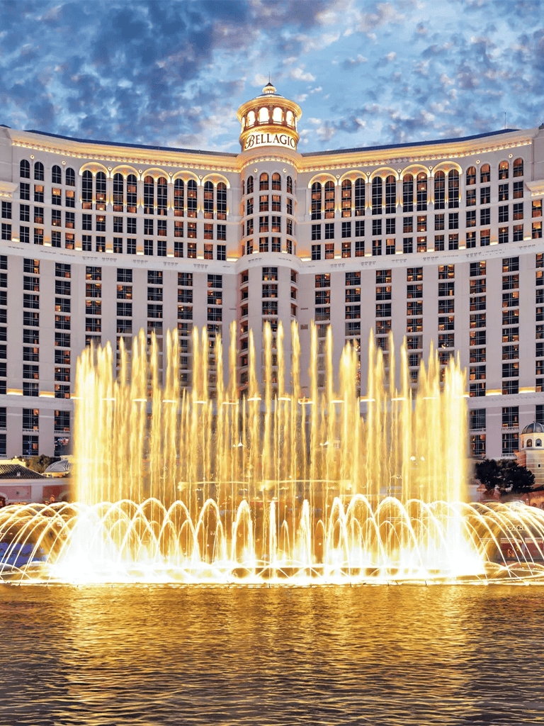 Elegant Bellagio Hotel fountain show at night in Las Vegas, Nevada.