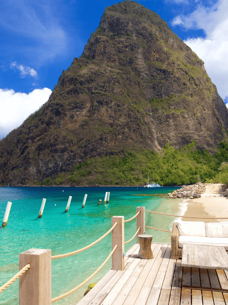 1. Spectacular coastal mountain view with turquoise waters and lush greenery.