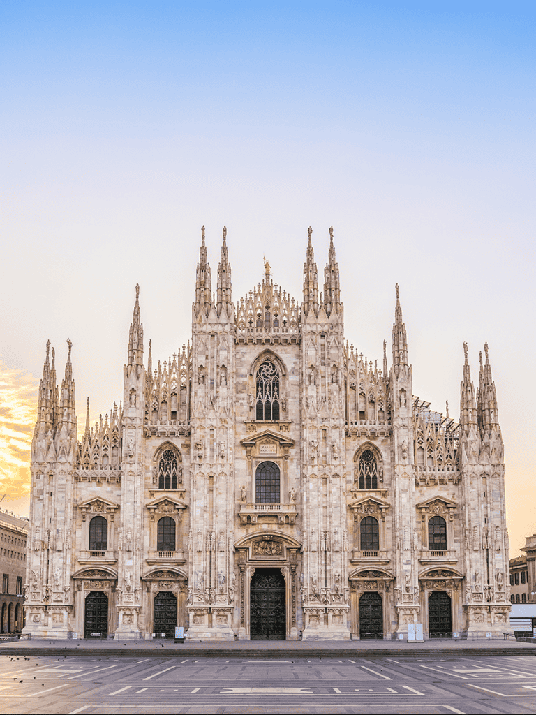 Stunning Milan Cathedral (Duomo di Milano) at sunrise, showcasing Gothic architecture and intricate details.