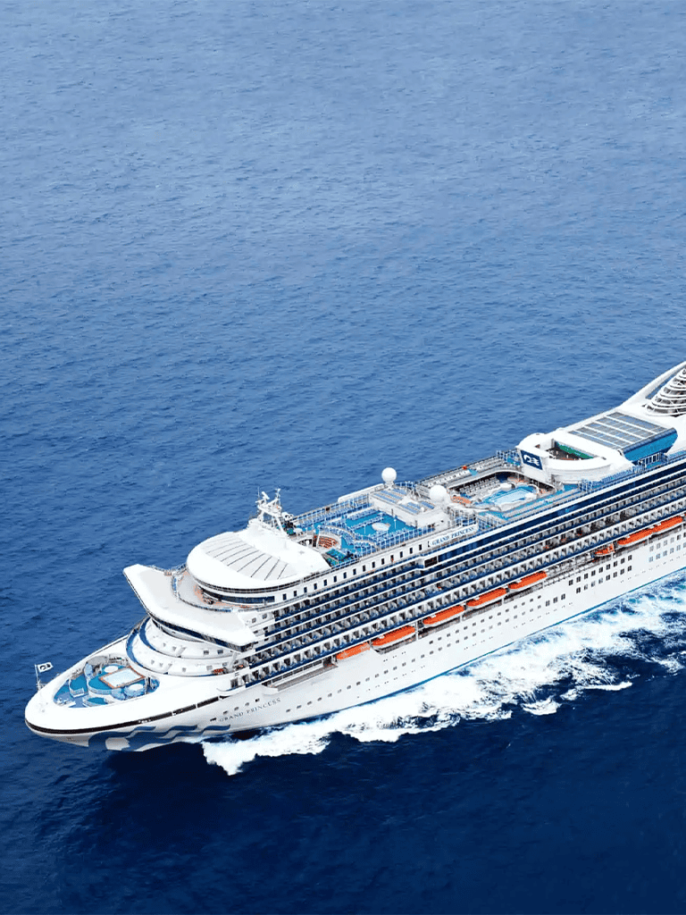 Luxurious cruise ship sailing on clear blue ocean, vacation, travel, adventure, ocean cruise, luxury cruise ship.