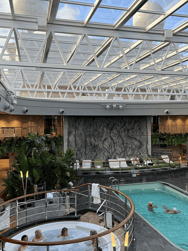 Relaxing indoor pool and hot tub at QuestForDirections luxury hotel with modern design and natural light.