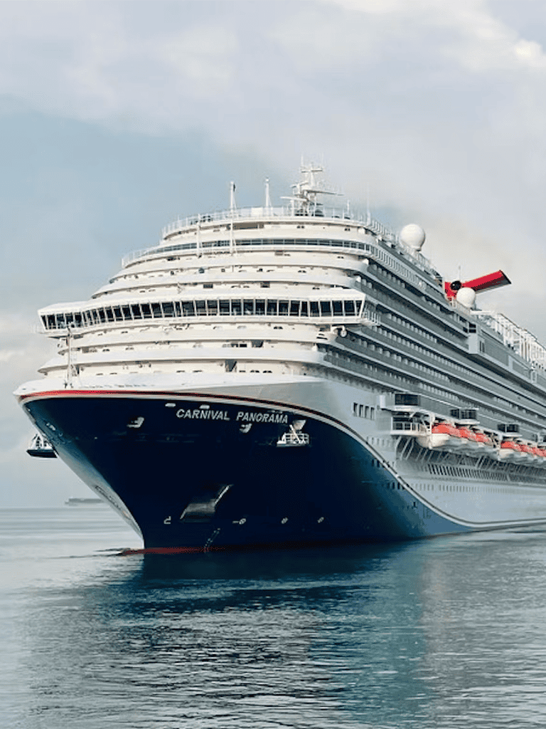Luxurious cruise ship Carnival Panorama sailing on calm sea, tropical cruise vacation, travel adventure.