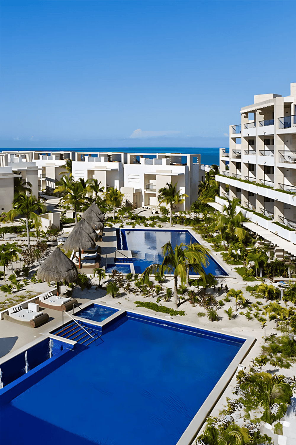 Luxury beachfront resort with pools and ocean views in Cancun.