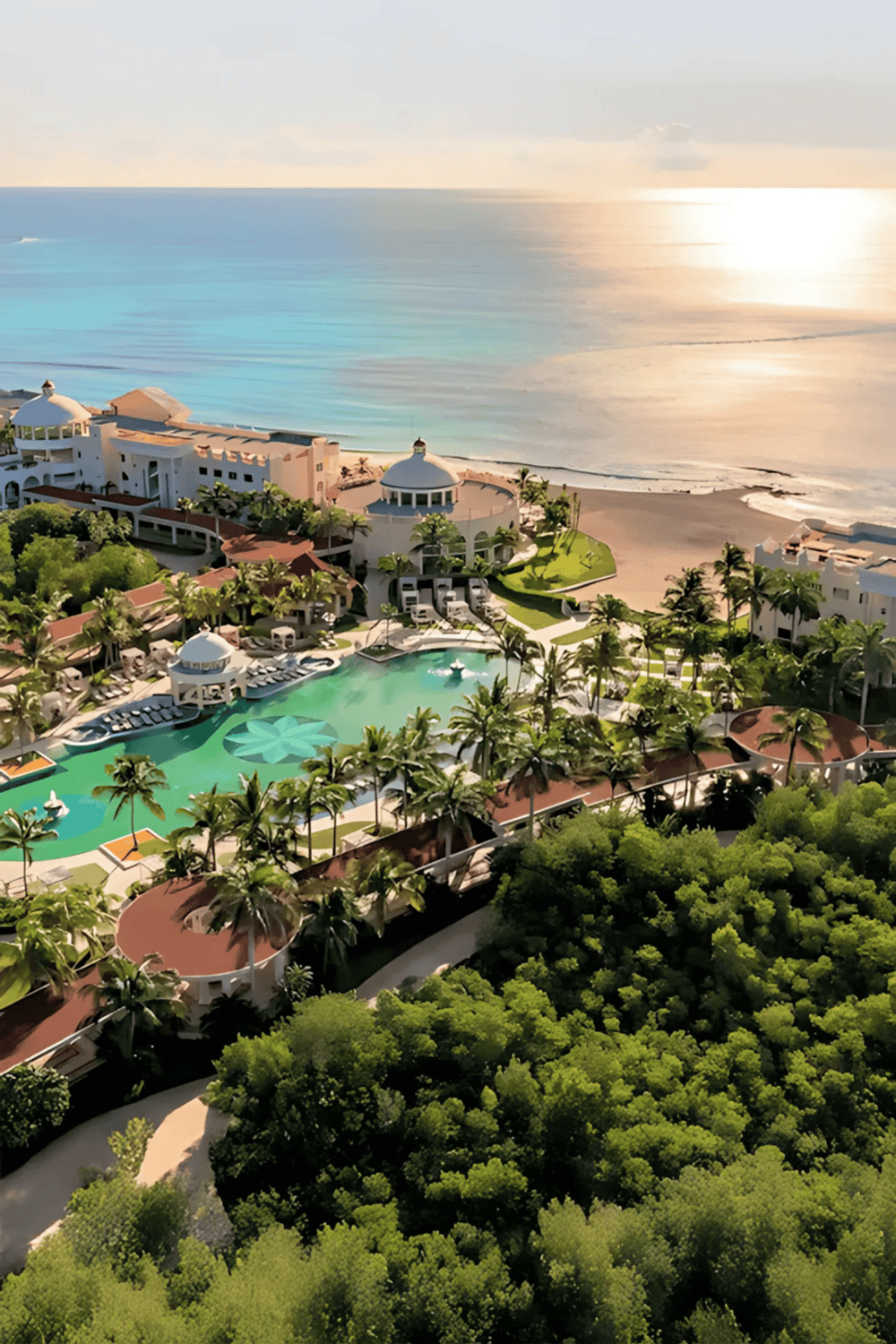 Luxurious oceanfront resort with infinity pool and palm trees in a tropical setting.