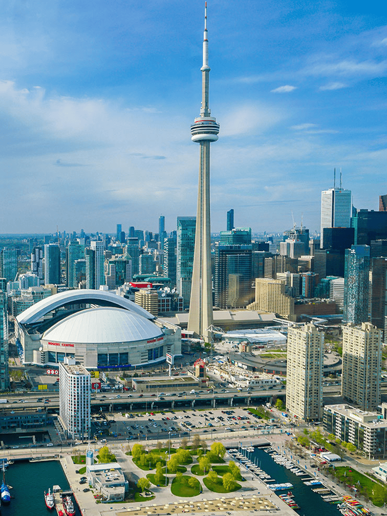 CN Tower and Toronto skyline, downtown cityscape with Rogers Centre stadium, vivid urban scenery.