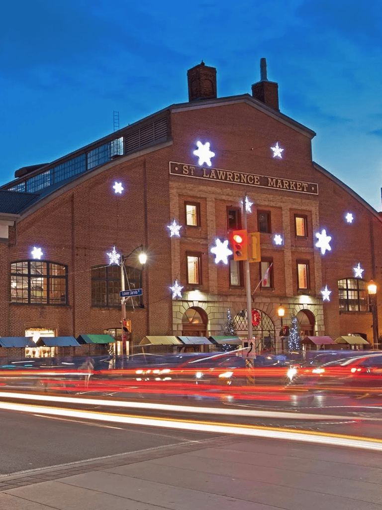 Festive holiday decorations at St. Lawrence Market in Toronto during winter evening.
