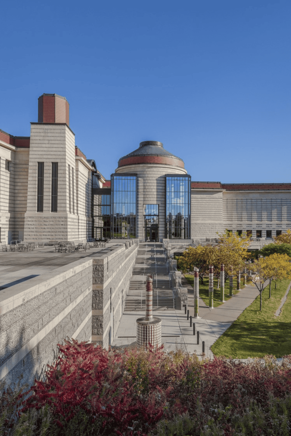 Historic courthouse with modern glass accents and landscaped surroundings for legal or civic purposes.