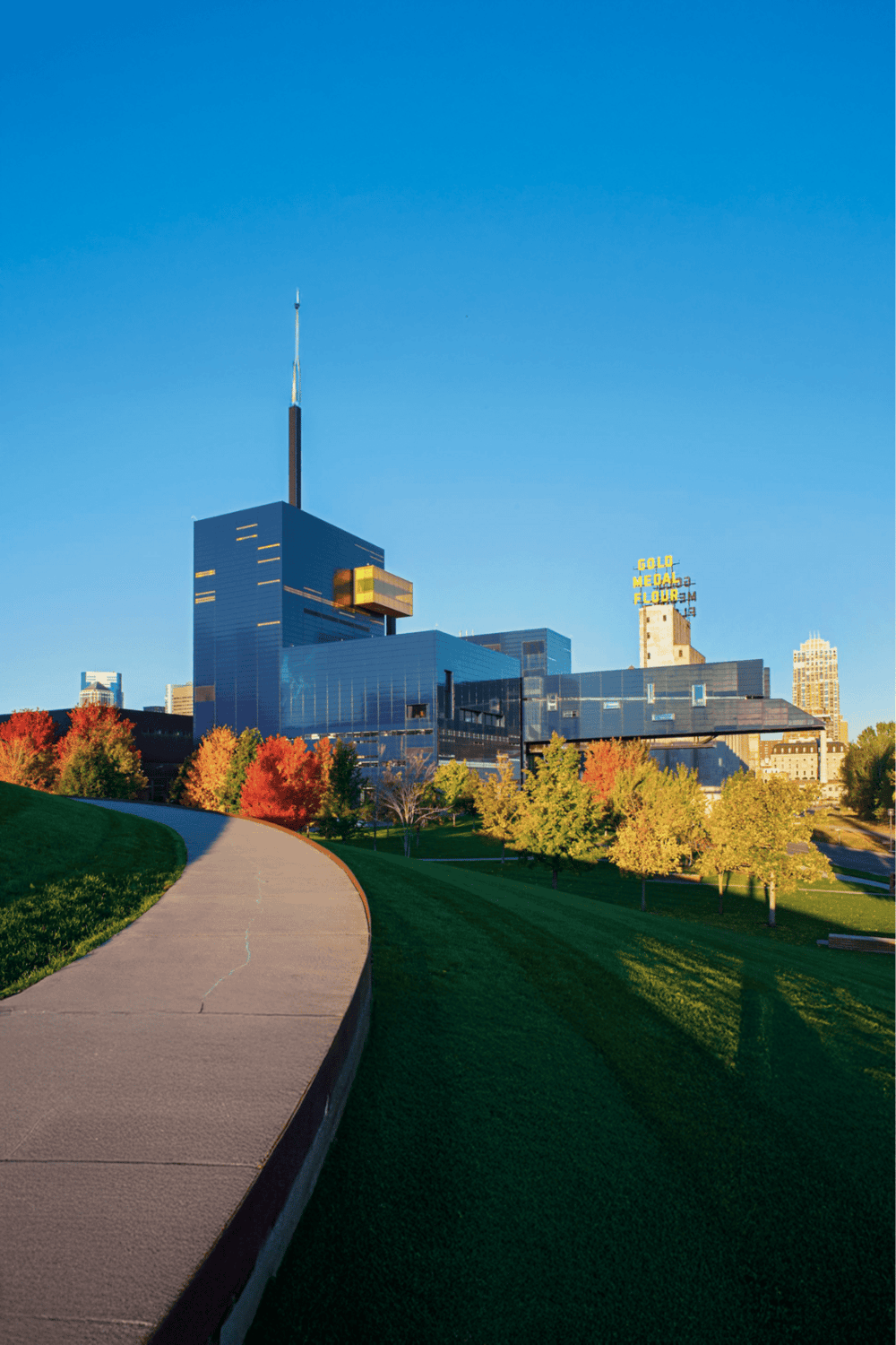 1. Downtown Detroit skyline with modern buildings and colorful fall trees.