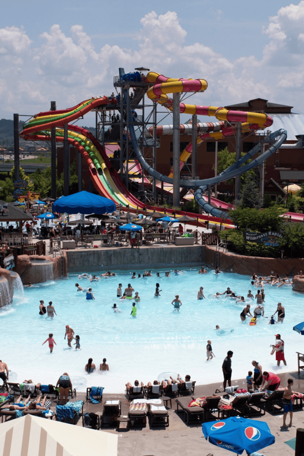 Water park with water slides and a large wave pool, family-friendly outdoor fun and relaxation.