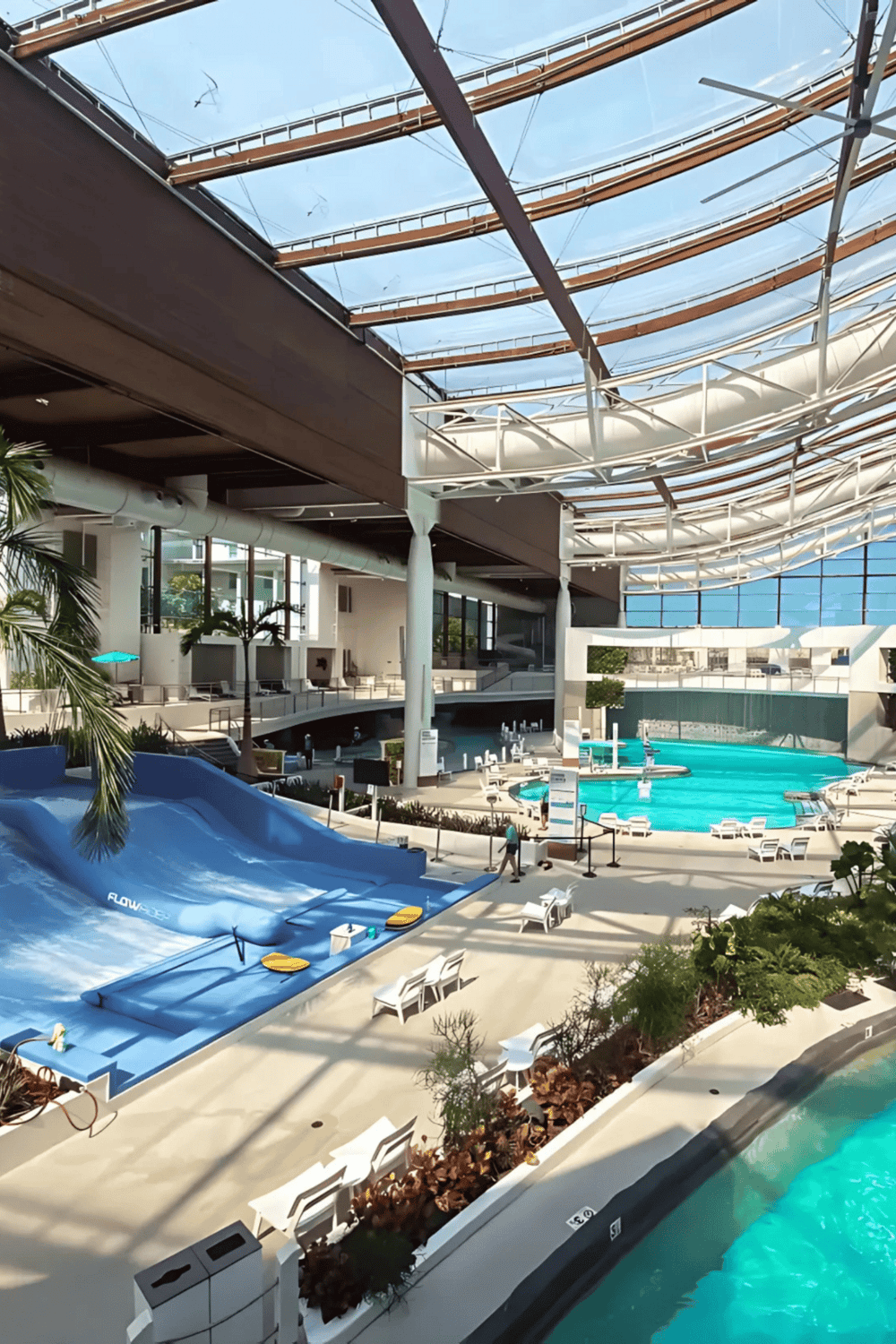 Indoor water park with lazy river, water slides, and lounging areas, at Quest for Directions.