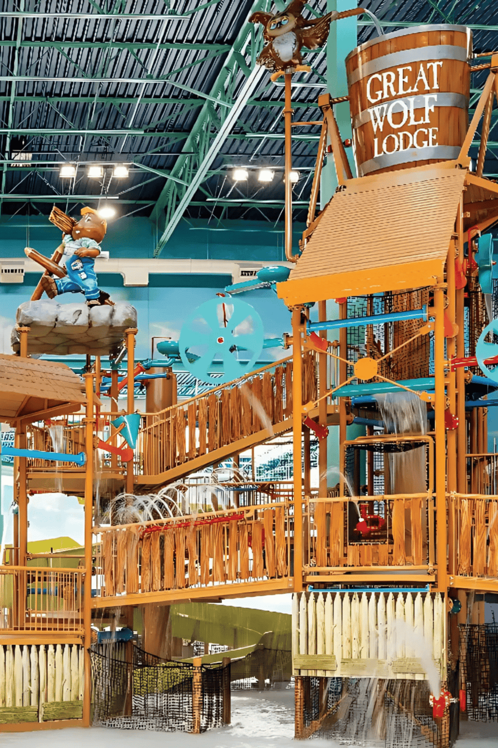 Slide and splash water play structure at Quest for Directions indoor water park, featuring themed aquatic fun and interactive water features.