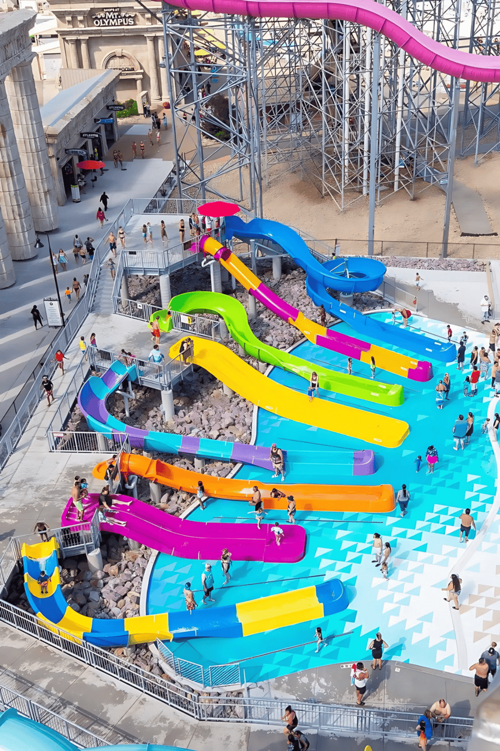 Colorful water slides at Quest for Directions amusement park - fun family water attraction.