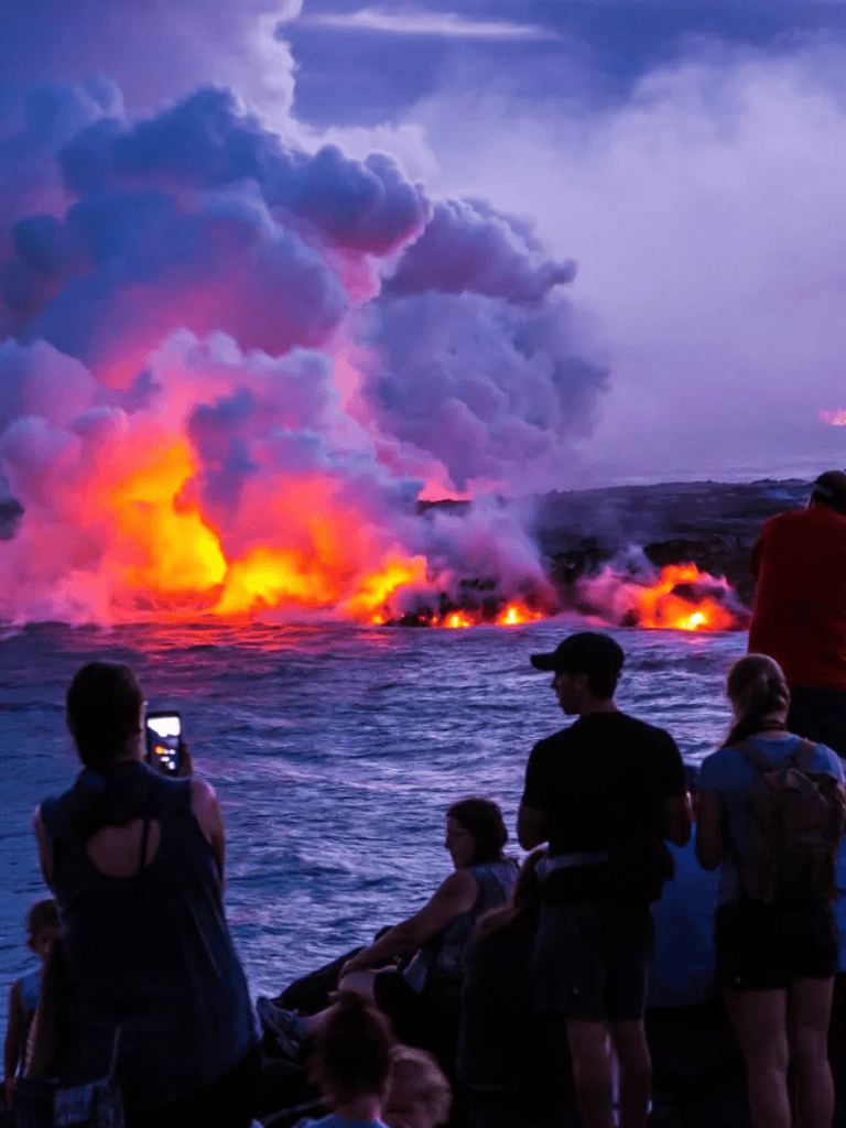 Volcano erupting with lava and smoke, people watching at sunset, Adventure travel, Nature experience.