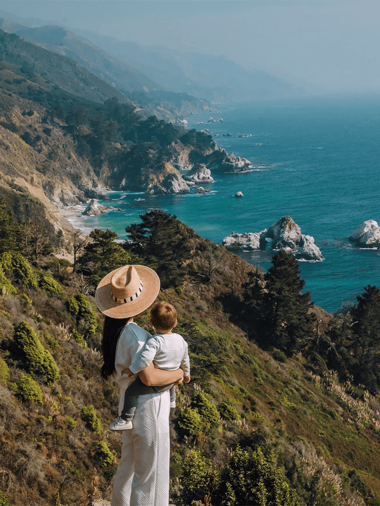 Spectacular coastal cliffs and ocean view with family enjoying scenic outdoor adventure.