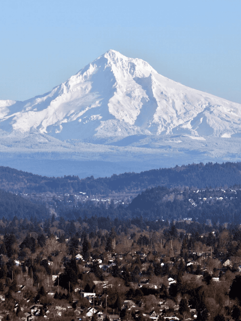 Snow-capped Mount Hood overlooking a residential neighborhood in Oregon.