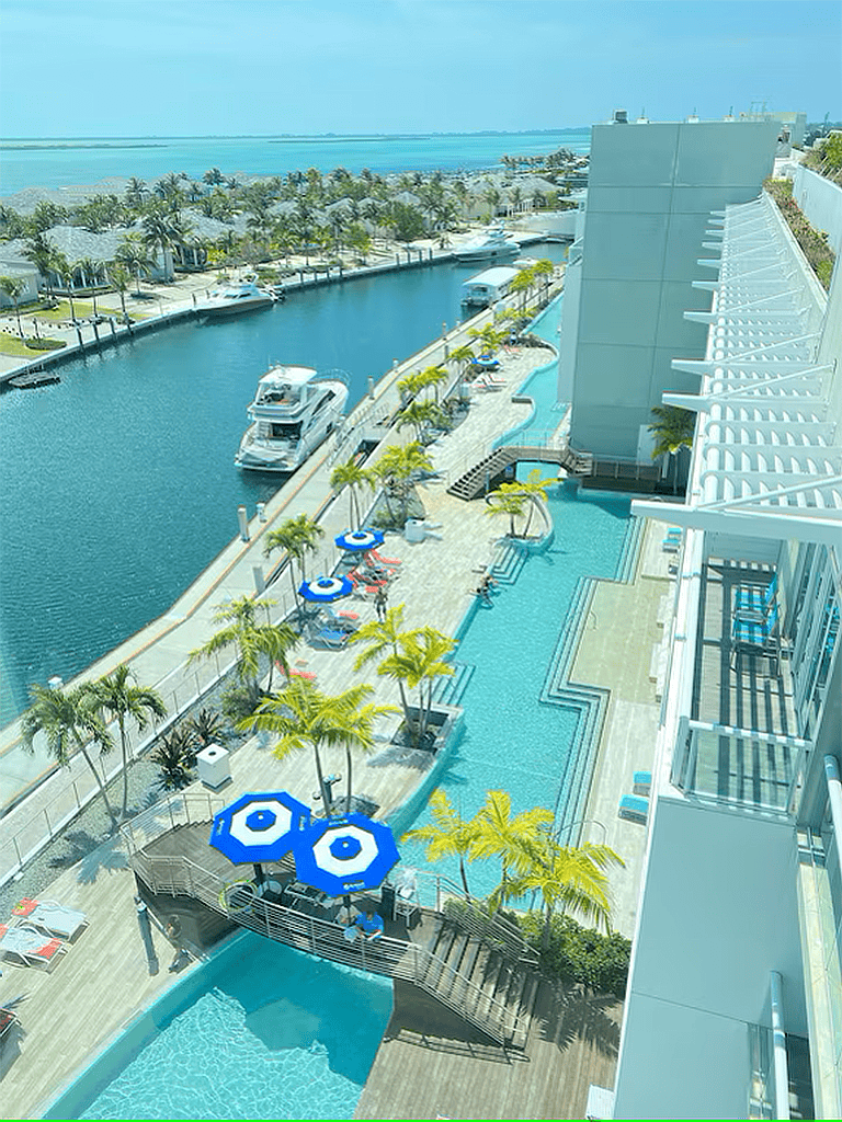 Luxurious waterfront hotel with pool and yacht marina at QuestForDirections.