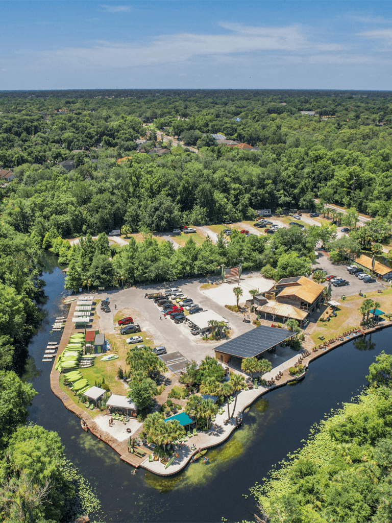 Bright green kayak rentals at Quest for Directions with water views and outdoor activities.