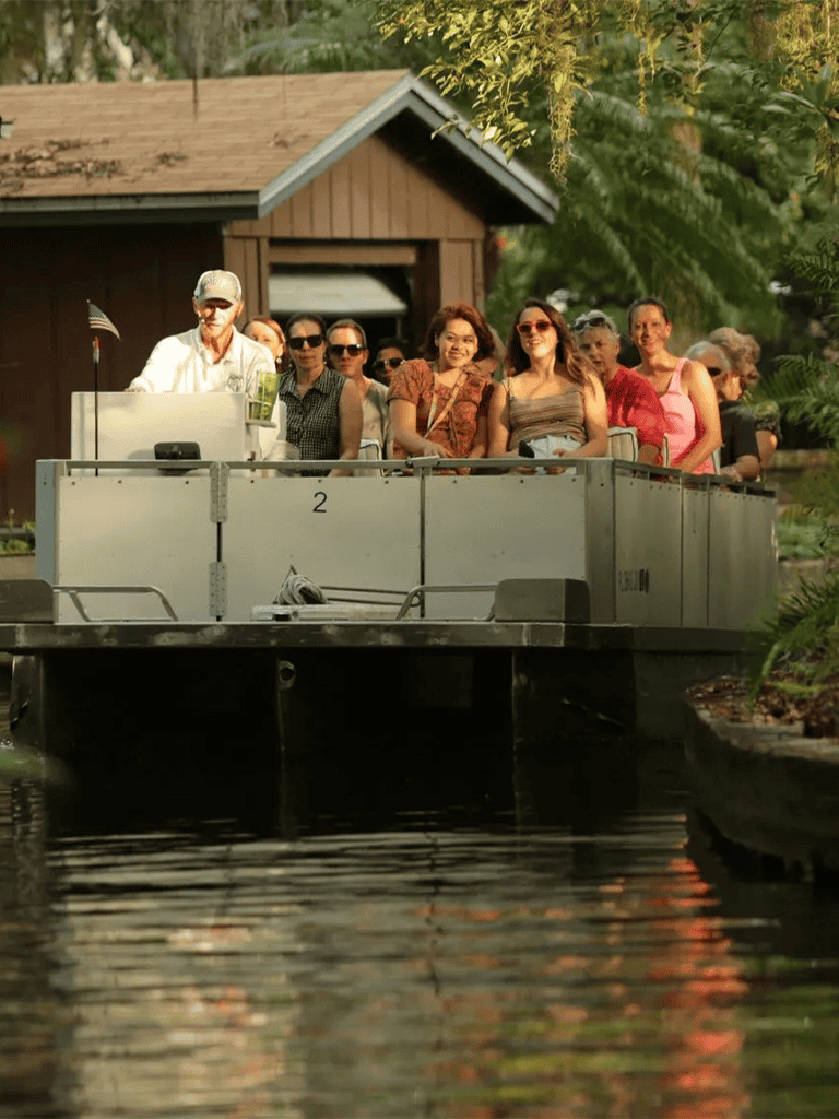 People enjoying a guided boat tour along a scenic canal at QuestForDirections.