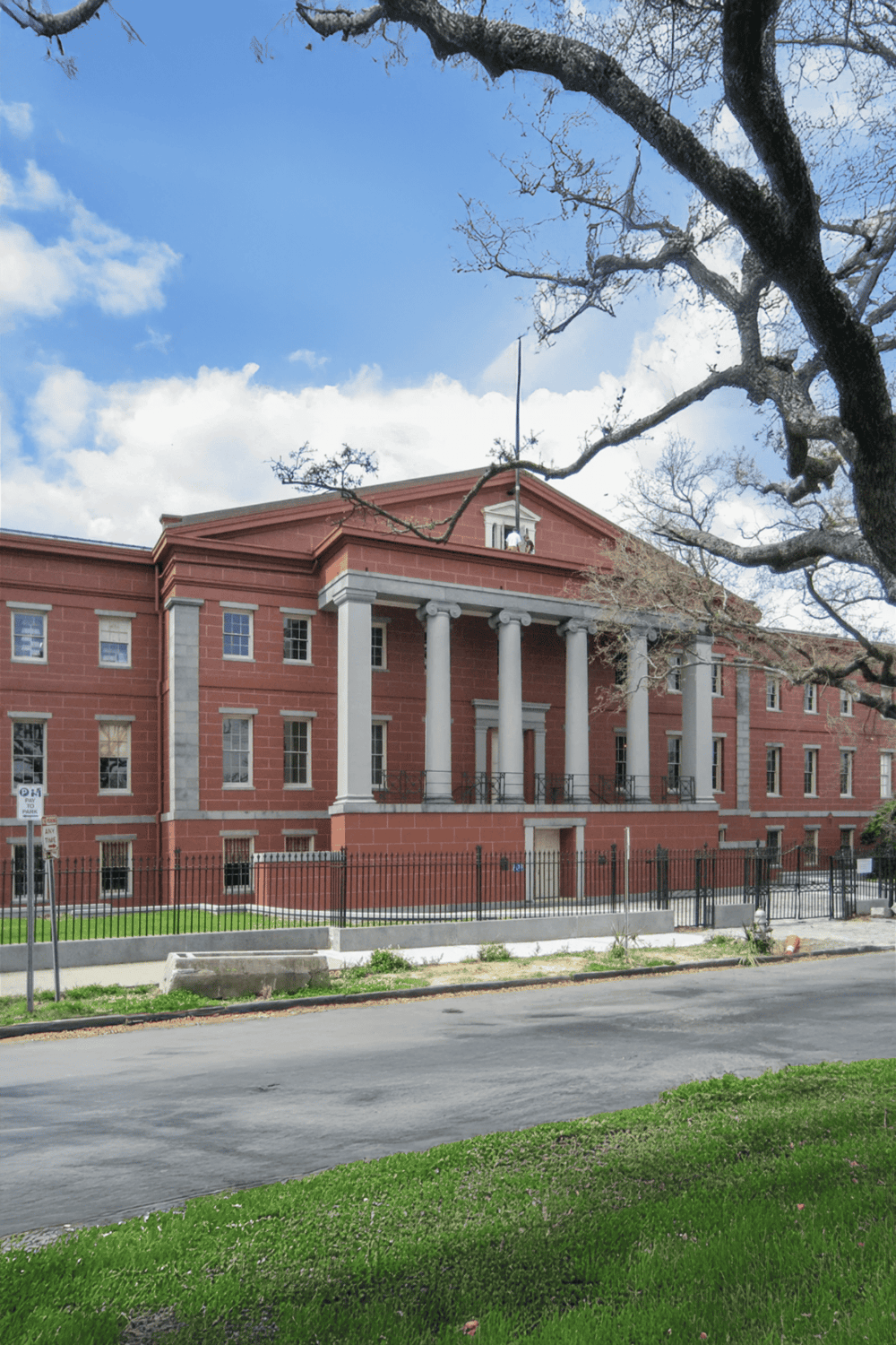 1. Historic courthouse building with classical columns and red brick exterior SEO.