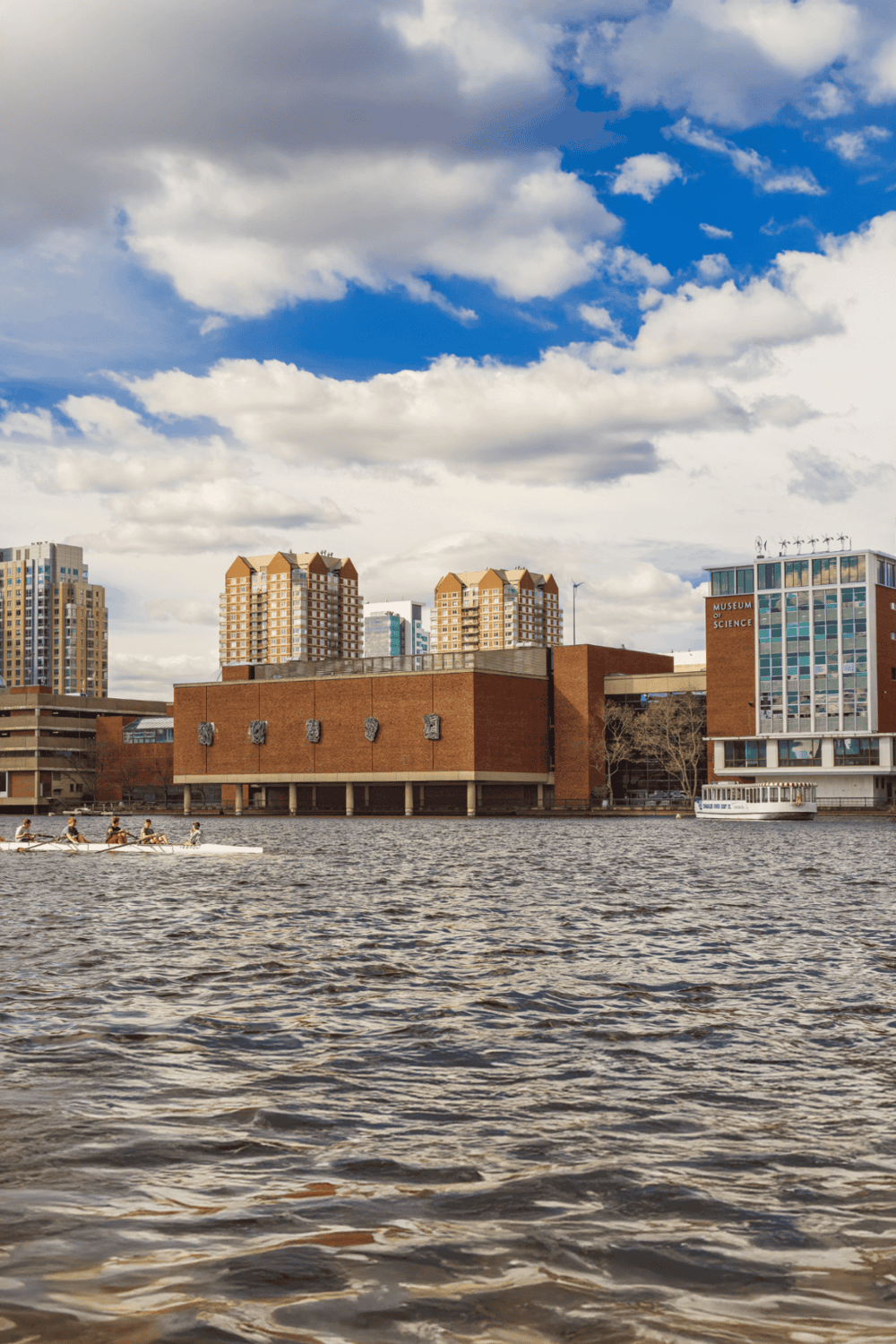 1. Modern cityscape with waterway, boats, and iconic architecture for urban exploration.