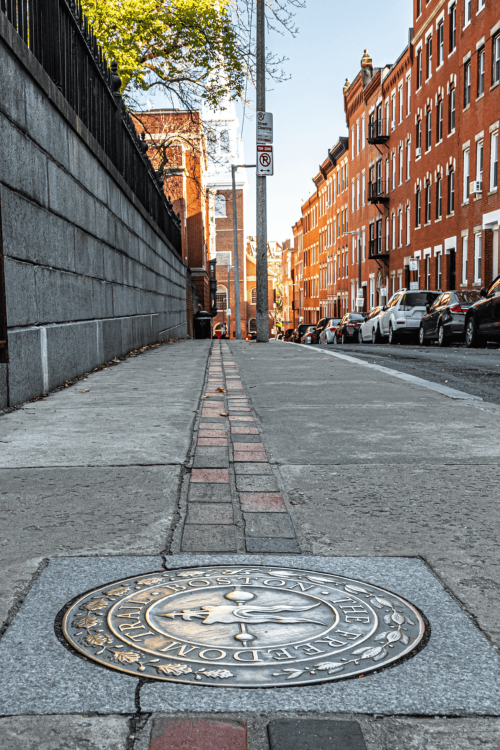 Historic Boston manhole cover on Downtown Boston sidewalk.