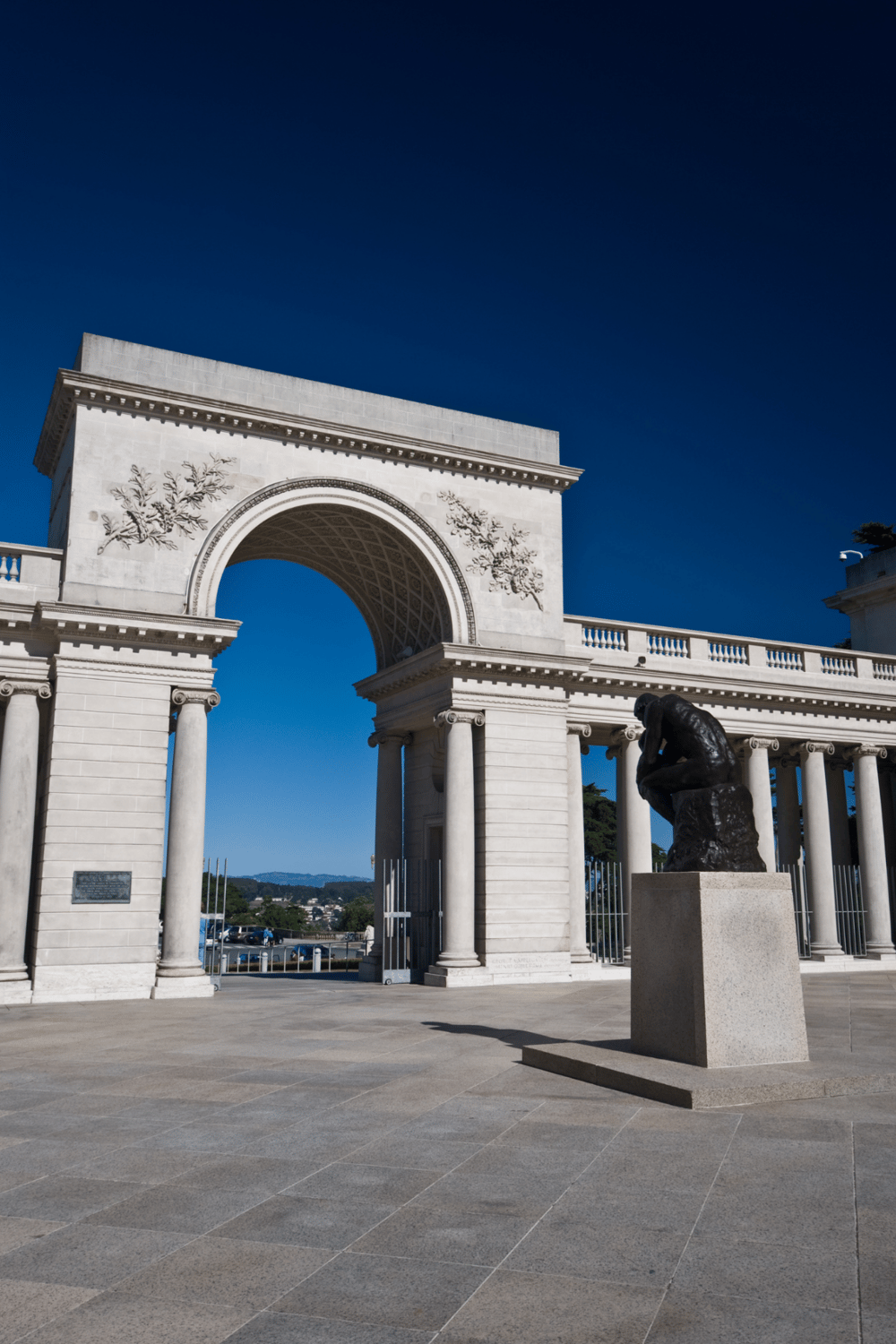 Ancient architectural arch with sculpture, offering guidance and navigation support for travelers.