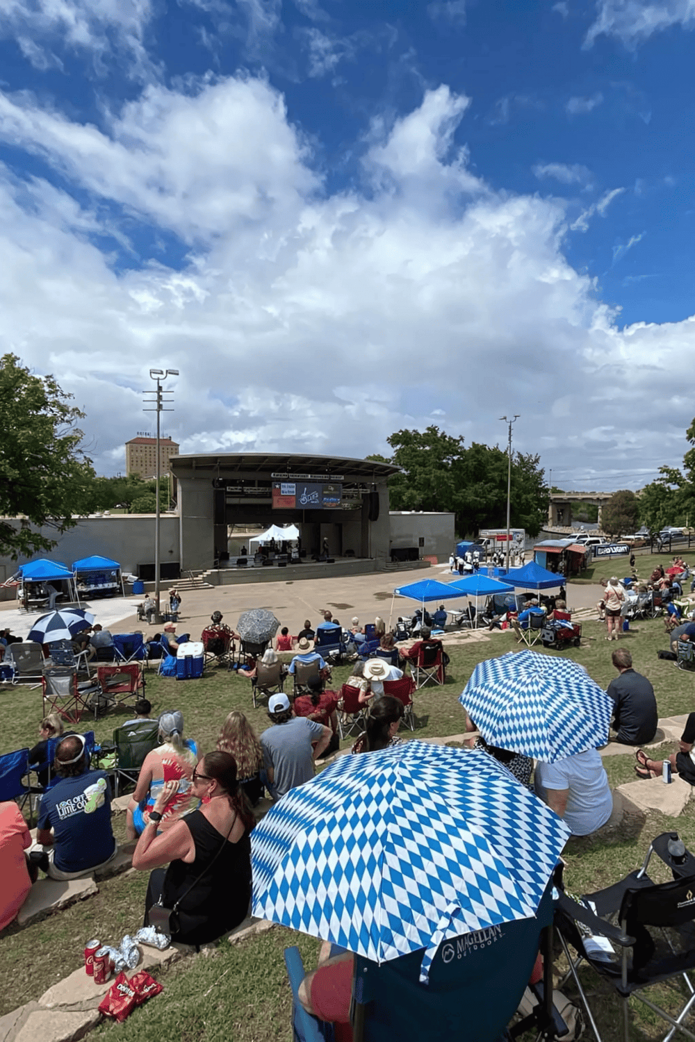 Crowd enjoying outdoor concert at Quest for Directions event venue.