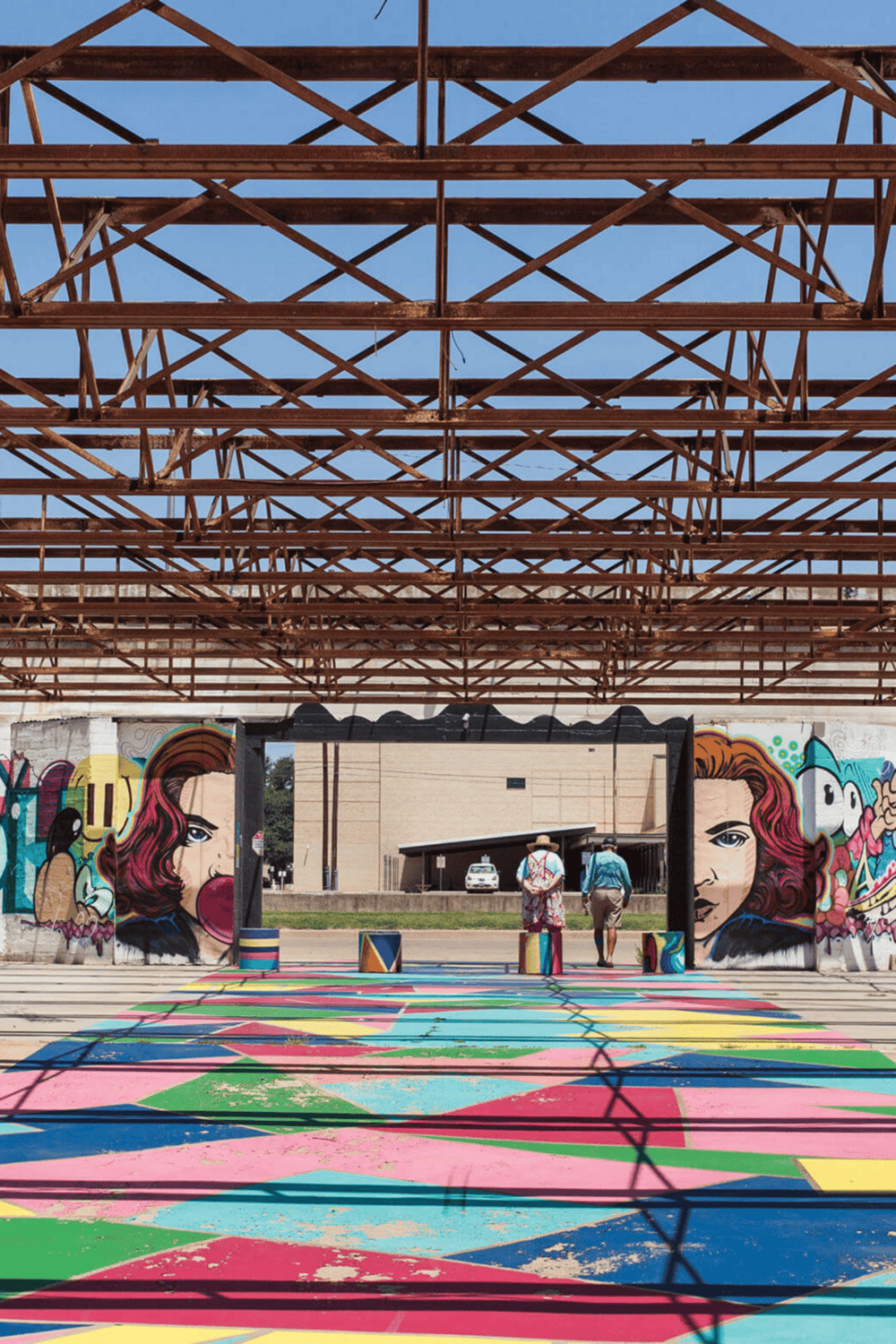 Colorful street art murals at QuestForDirections urban space, vibrant graffiti artwork and public art installation.