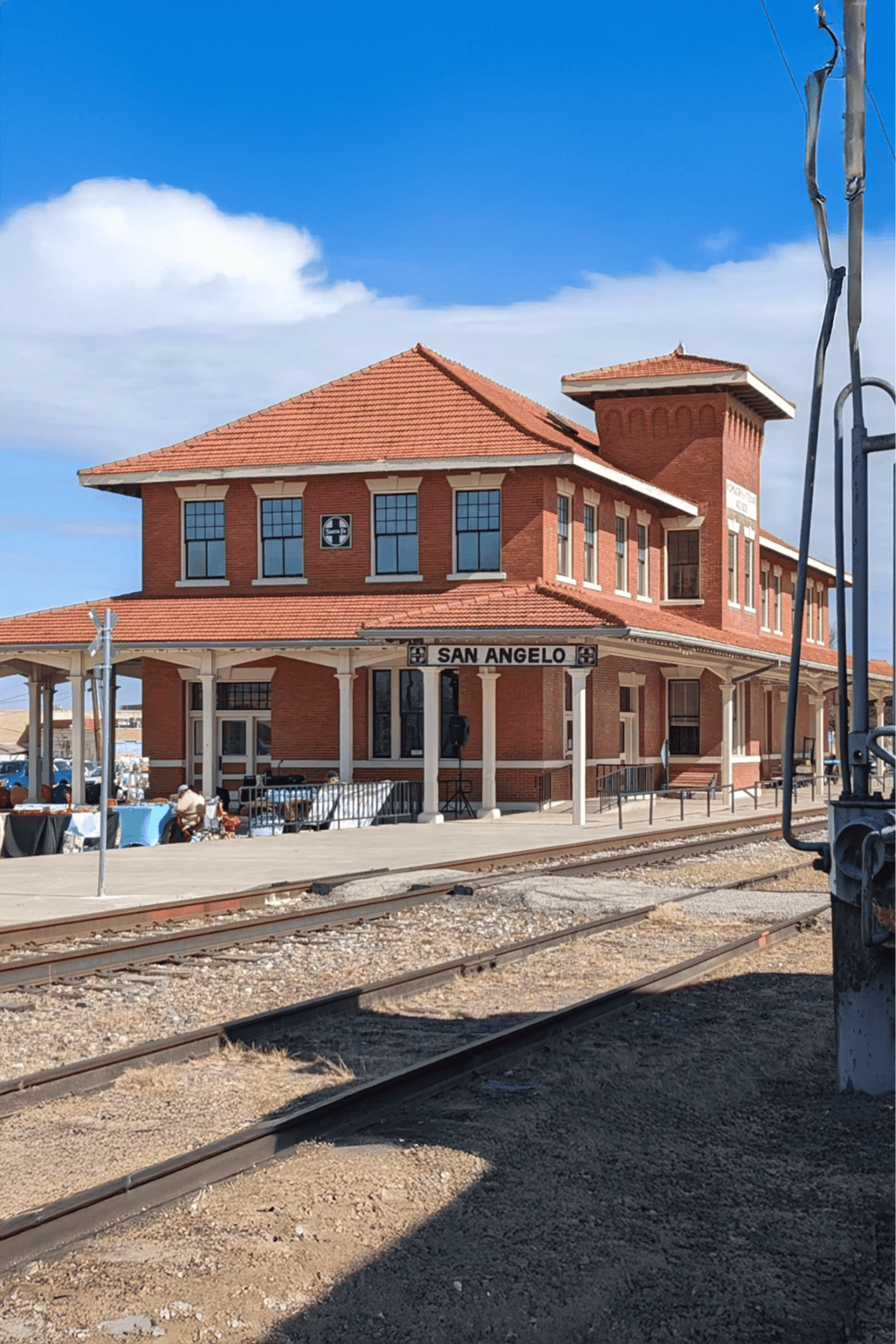 Historic San Angelo train depot in Texas, a charming landmark with vintage architecture and train tracks.