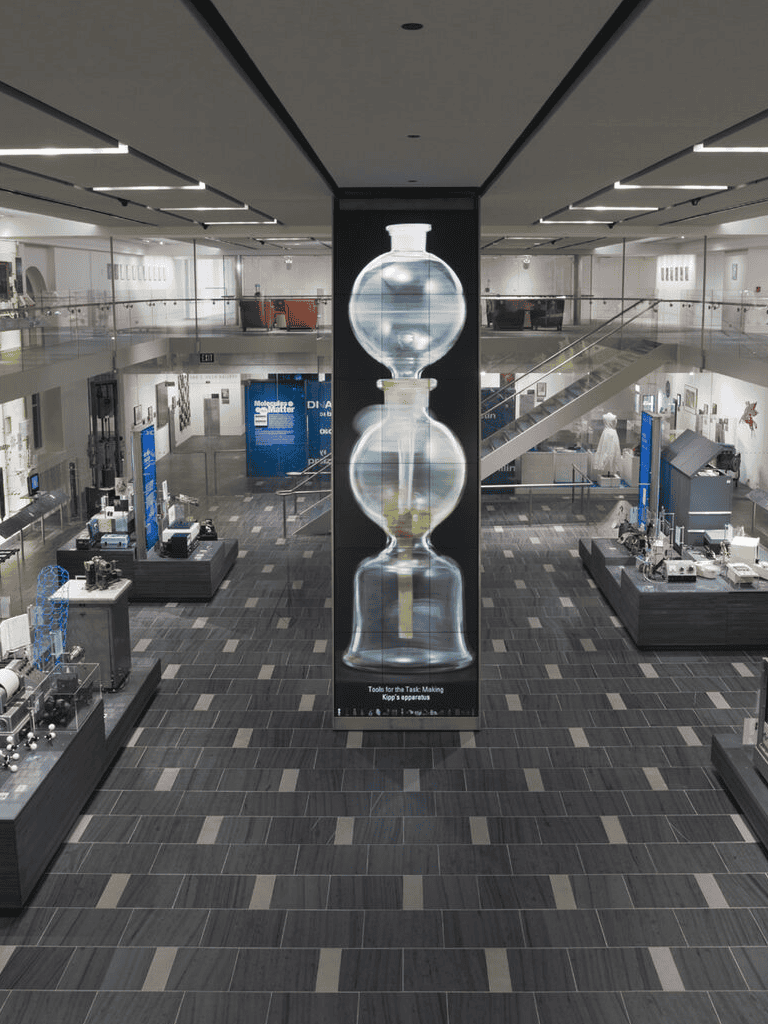 1. Modern science exhibit in a spacious museum with interactive displays and scientific tools.