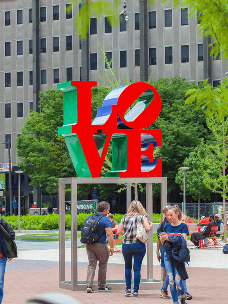 LOVE sculpture in New York City park, colorful outdoor artwork, popular tourist photo spot.