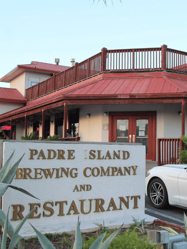 Historic Padre Island Brewing Company restaurant and bar with outdoor seating area.