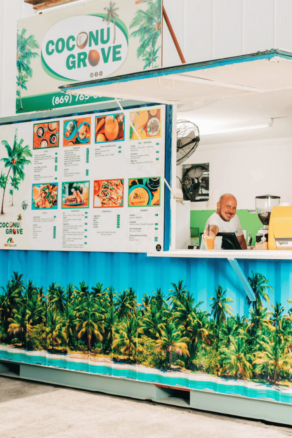 Colorful Coconut Grove food stand with tropical decor, tropical drinks, vibrant menu, friendly staff, and island-themed design.