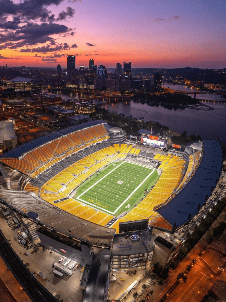 Night skyline of Nashville with Nissan Stadium in foreground.