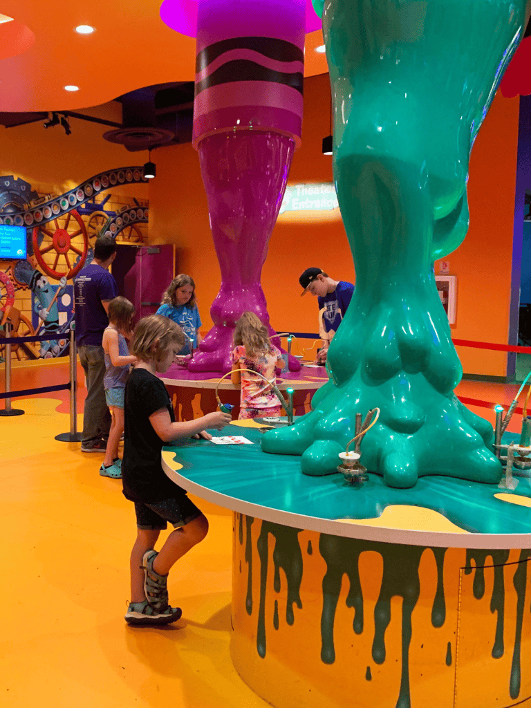 Colorful interactive science exhibit at Quest for Directions in a vibrant indoor play area.