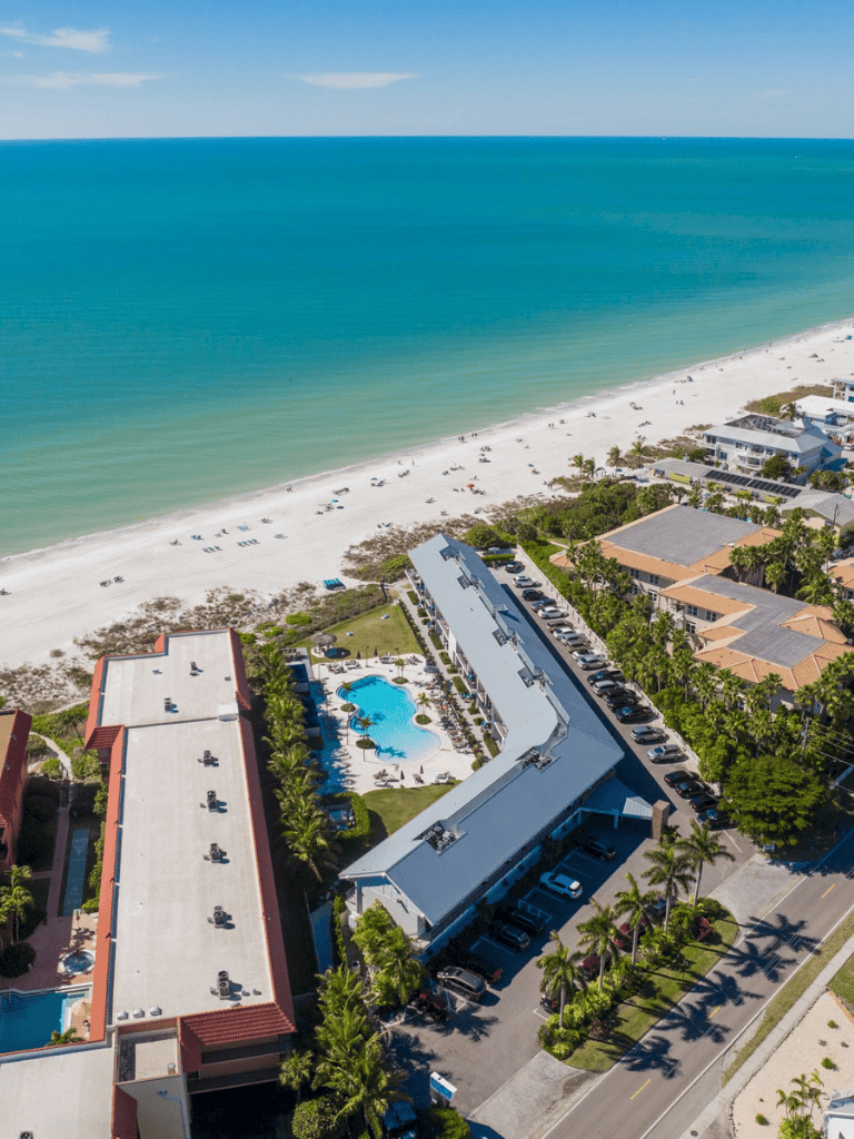 Beachfront hotel with pool in Florida’s coastal town, perfect for vacation and relaxation.